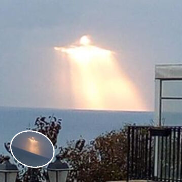 Man captures glowing figure shining through clouds: Many say it looks like Christ the Redeemer